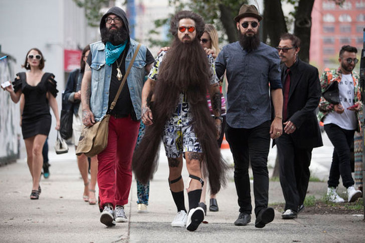 group of men walking with extravagant beards