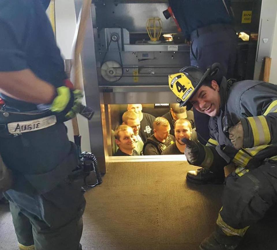 cops stuck in elevator - Sciotta AdGIE