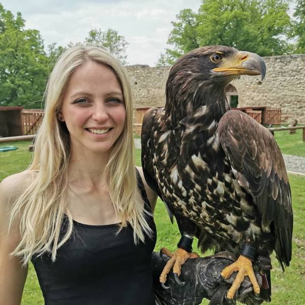 woman holding a bird