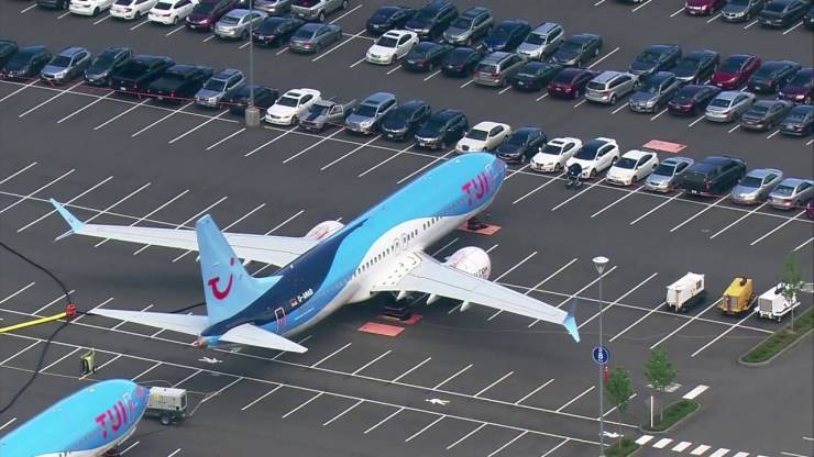 airplane parked in parking lot