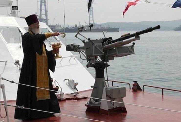 orthodox priest blessing weapons
