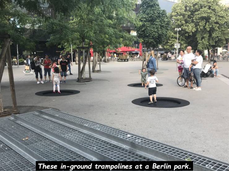 funny pics - asphalt - These inground trampolines at a Berlin park.