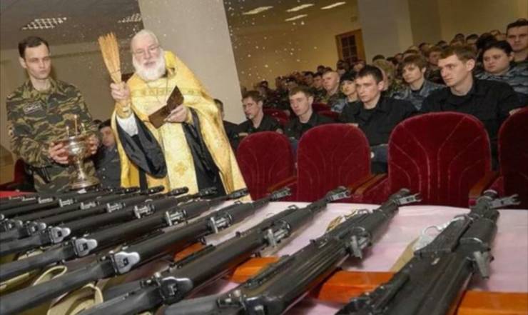 priest blessing guns