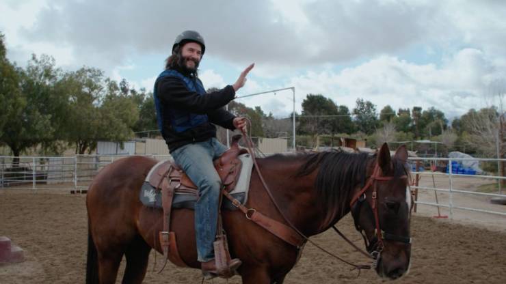 keanu reeves riding a horse