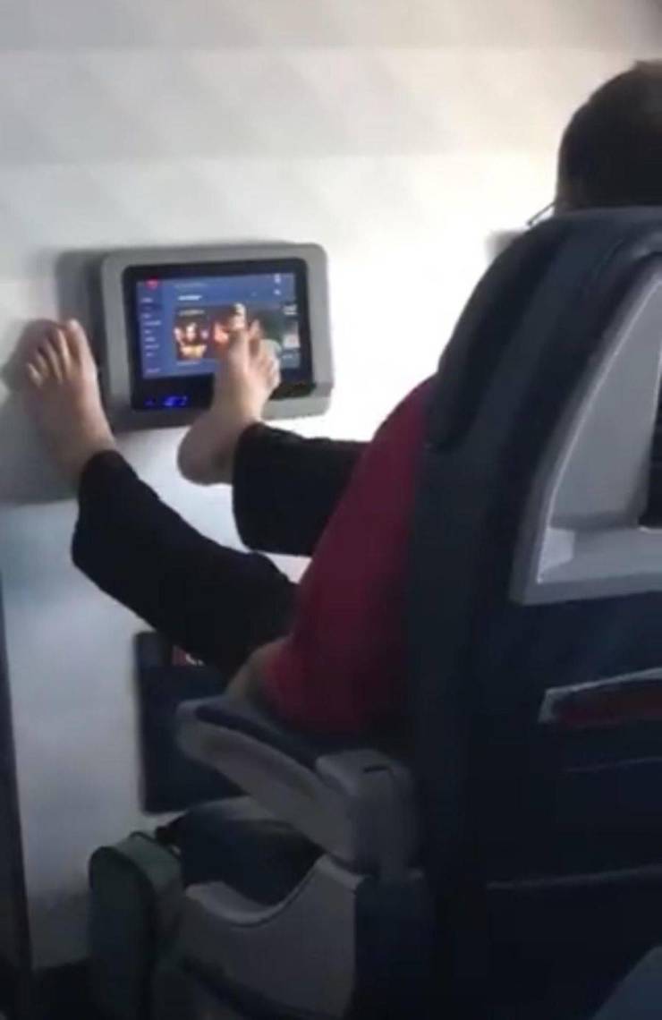 feet on plane screen