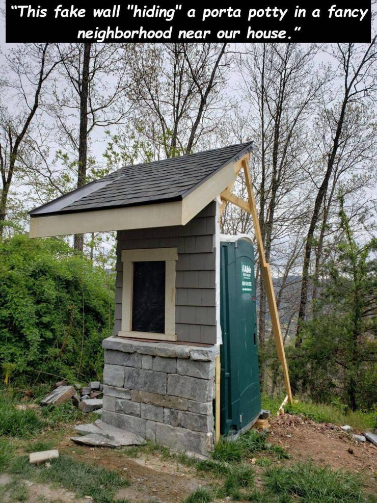 shed - "This fake wall "hiding" a porta potty in a fancy neighborhood near our house."