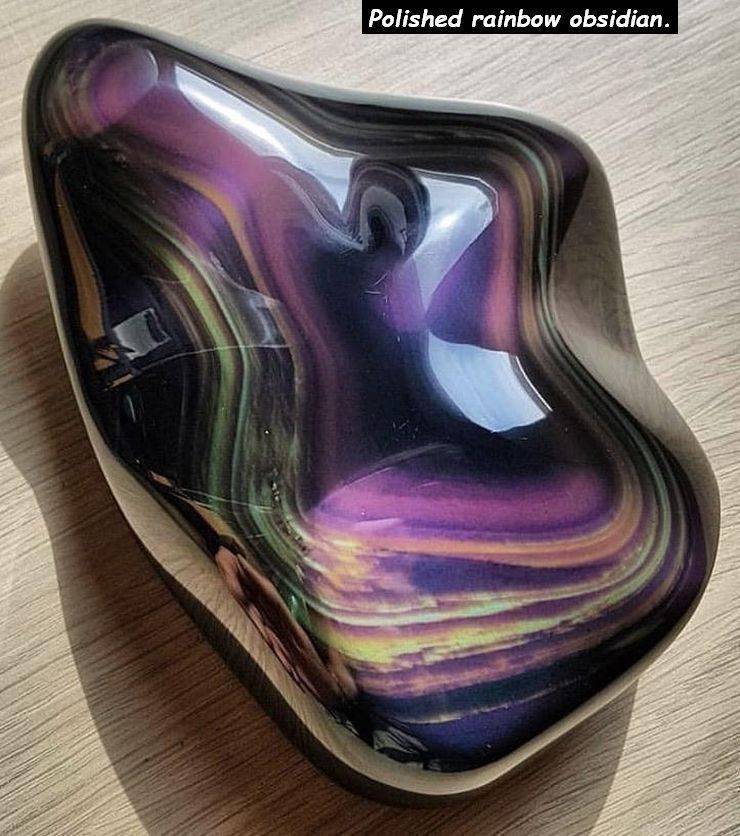 glass - Polished rainbow obsidian.