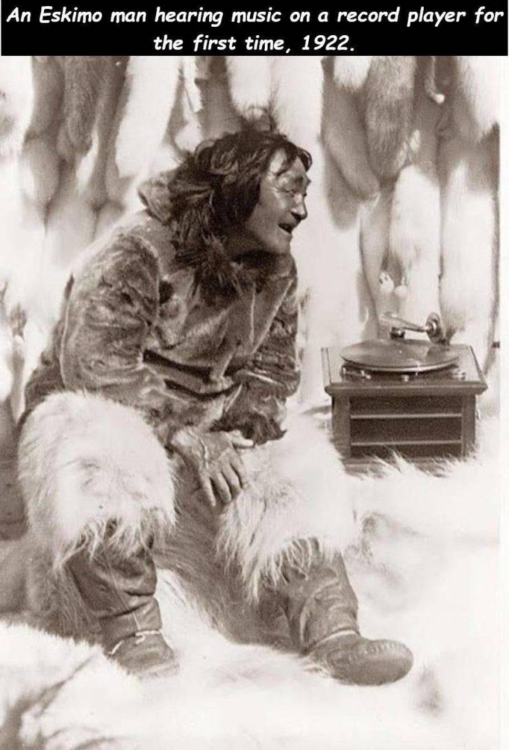 eskimo listening to vinyl - An Eskimo man hearing music on a record player for the first time, 1922.