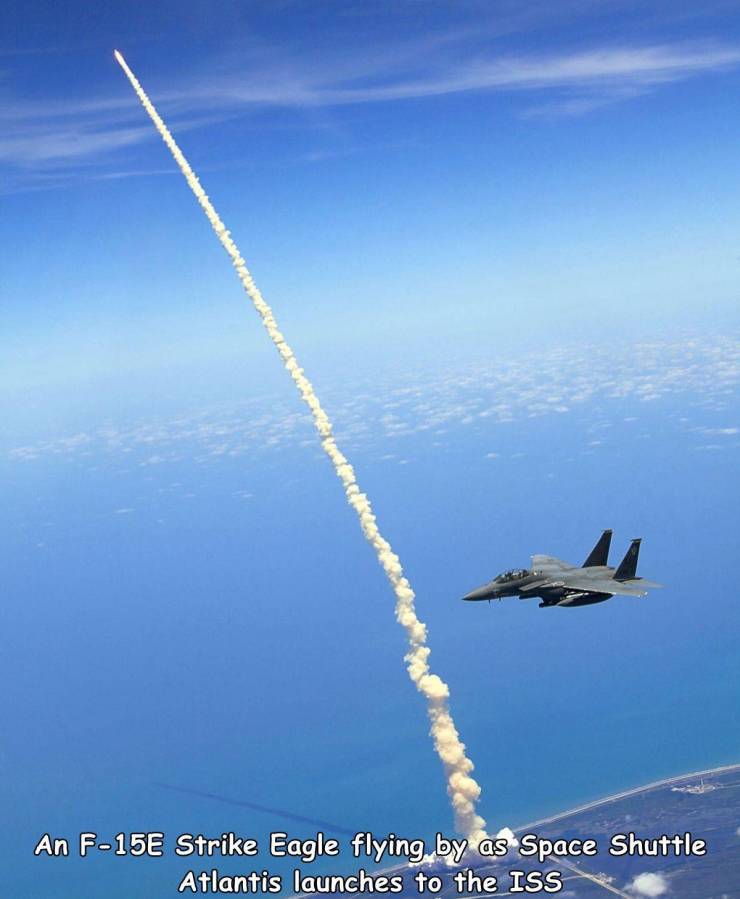 space shuttle launch from space - An F15E Strike Eagle flying by as Space Shuttle Atlantis launches to the Iss