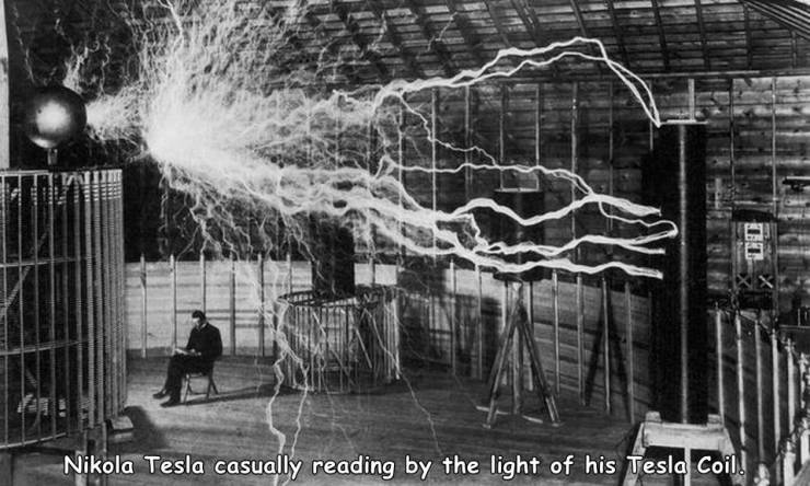 nikola tesla tesla coil - Nikola Tesla casually reading by the light of his Tesla Coil.