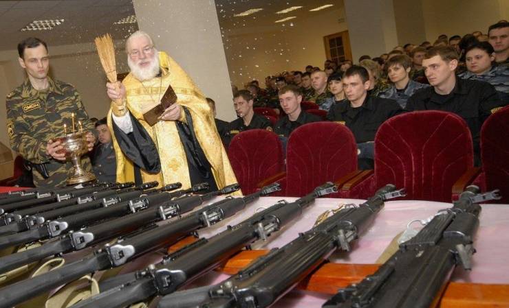orthodox priest blessing guns - Omon