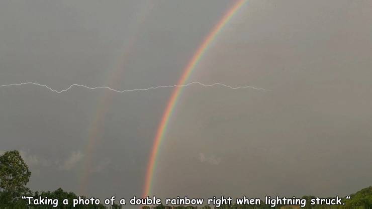rainbow - "Taking a photo of a double rainbow right when lightning struck."