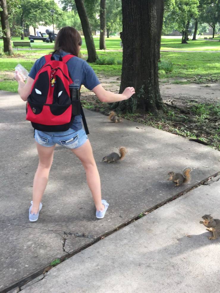 woman having standoff with squirrels