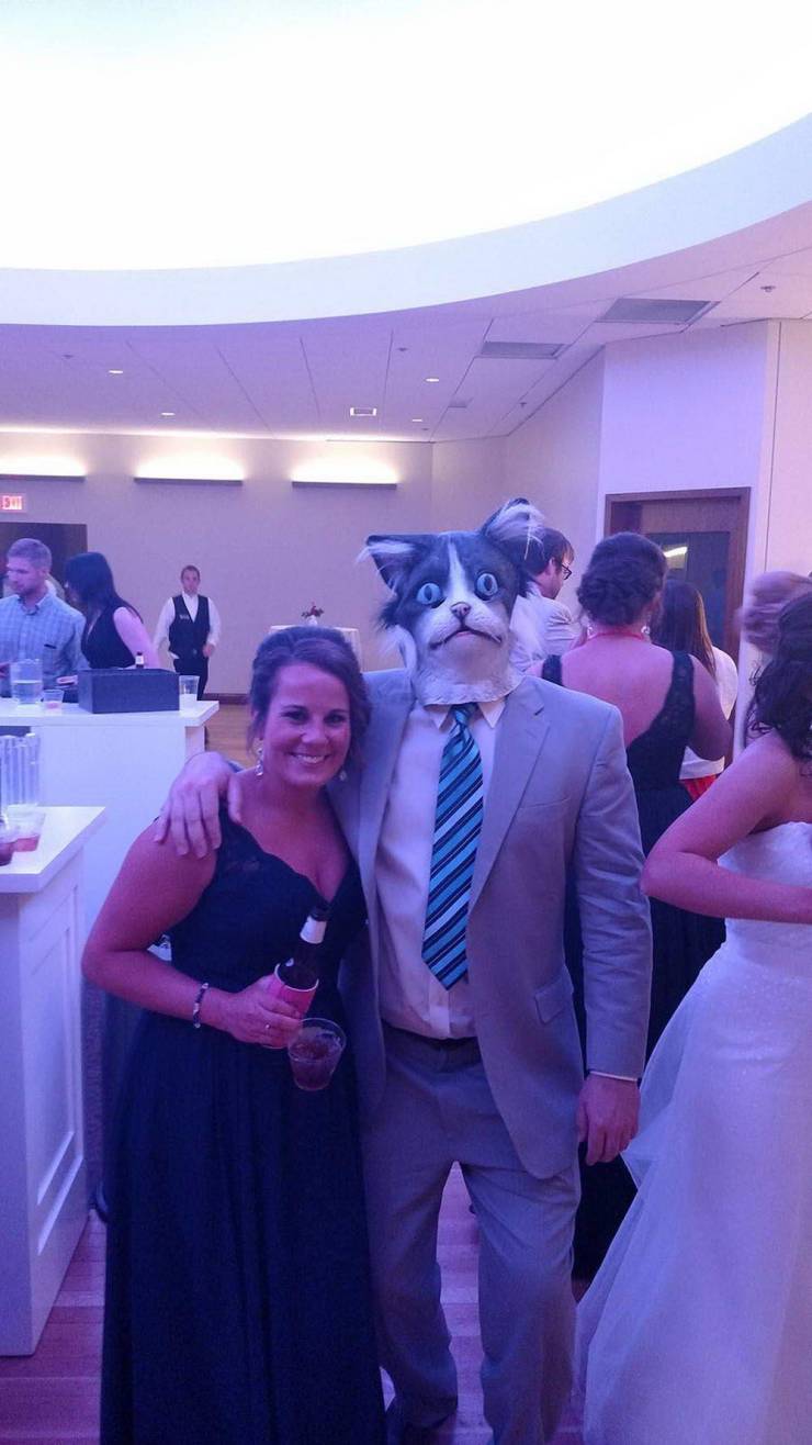 guy wearing cat mask at wedding