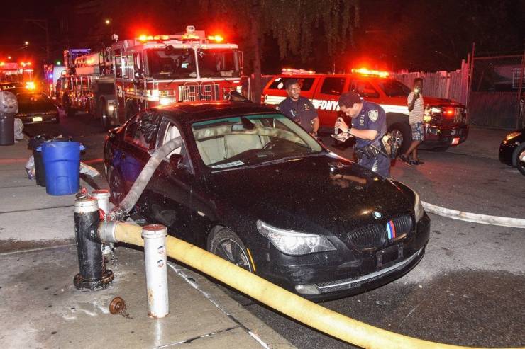 firefighters put hose through car window