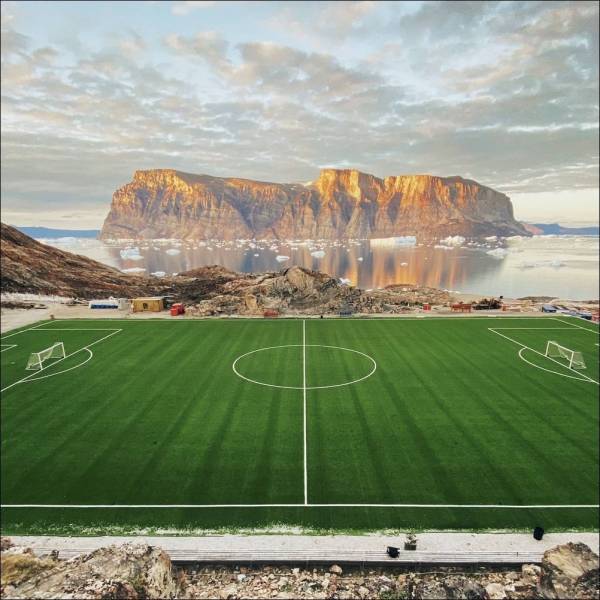soccer pitch with majestic mountains in the background