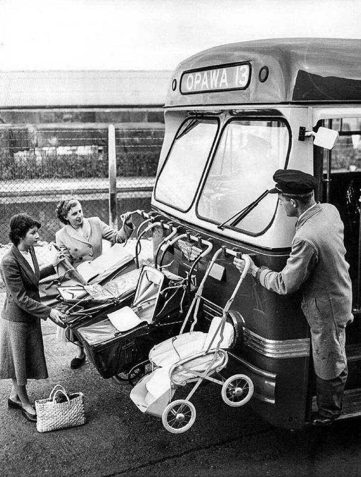 1940s pram baby carriages hung on front of bus