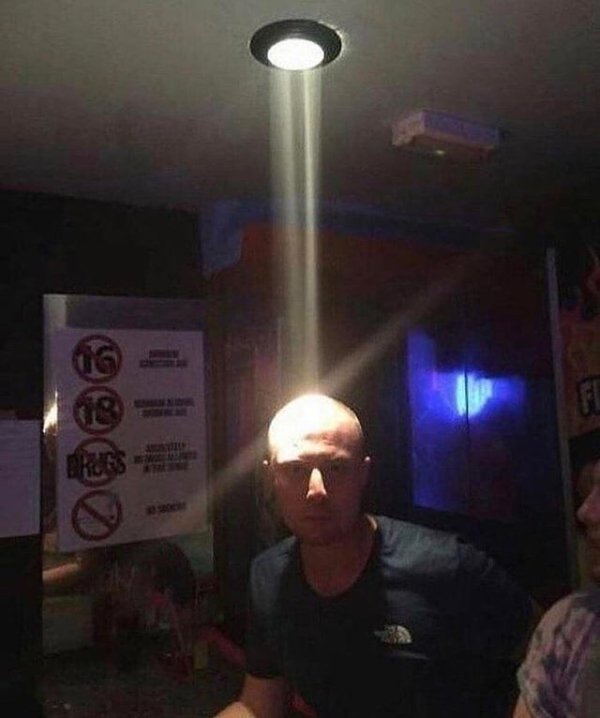 light shining onto bald guy's head