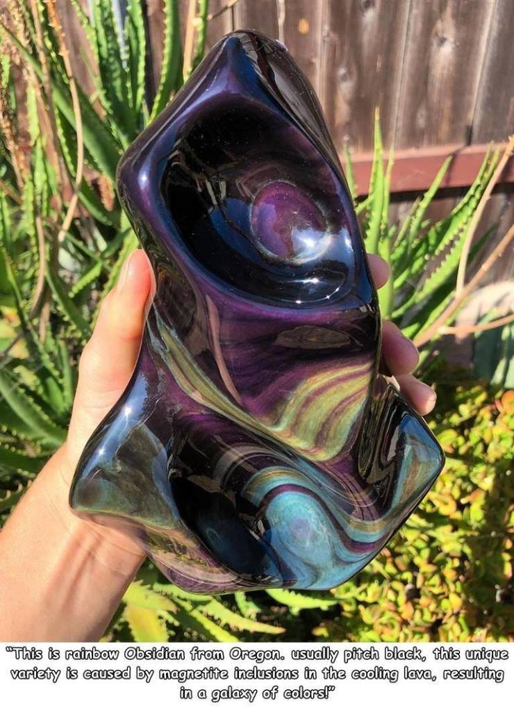 grass - "This is rainbow Obsidian from Oregon. usually pitch black, this unique variety is caused by magnetite inclusions in the cooling lava, resulting in a galaxy of colorsl