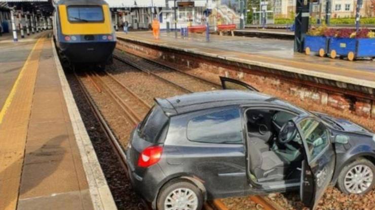 fascinating photos - tiny car parked on a train track