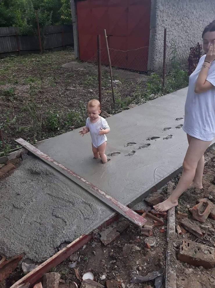 baby walking in cement