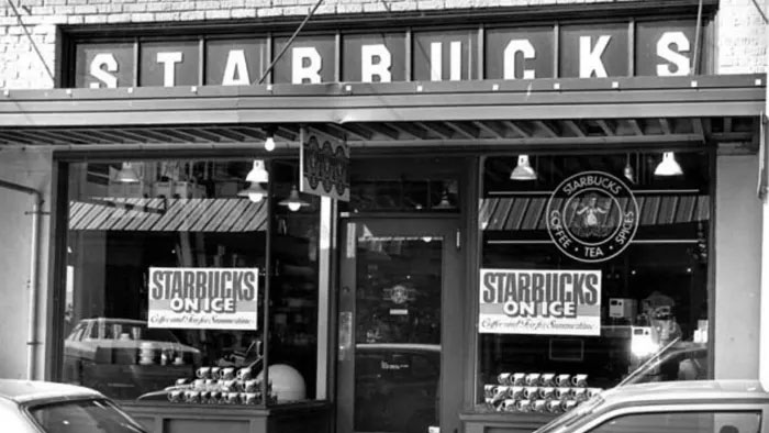 Starbucks, 1971 The first Starbucks was opened by University of San Francisco grads Jerry Baldwin, Gordon Bowker and Zev Siegl in 1971 in Seattle, and just sold coffee beans. This all changed when Howard Schultz came on board who, inspired by Italian coffee culture, turned Starbucks' coffee shops into the social meeting places we know today when he bought the chain in 1987