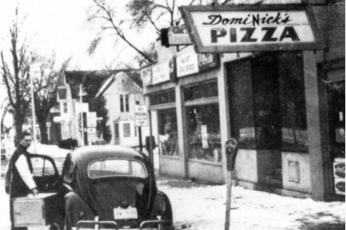 Domino's Pizza, 1960 The original plan between the two Monaghan brothers was to trade off shifts so Tom could continue his studies and Jim could keep up his job as a mailman. But within eight months of buying the pizzeria, Jim decided to focus solely on his job with the post office. Tom traded him the Volkswagen they used for deliveries for sole ownership of the business.