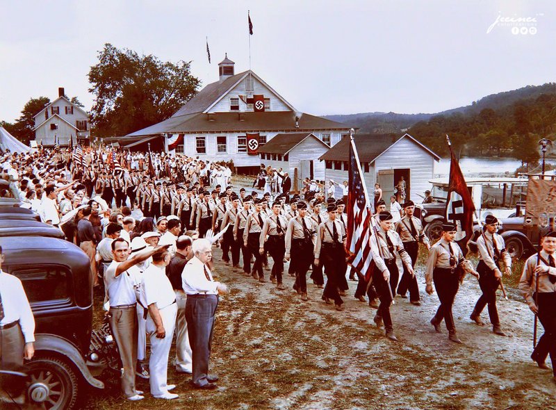 The American Nazis – Nearly 1,000 uniformed men, wearing swastika arm bands and carrying Nazi banners, parade past a reviewing stand in New Jersey on July 18, 1937