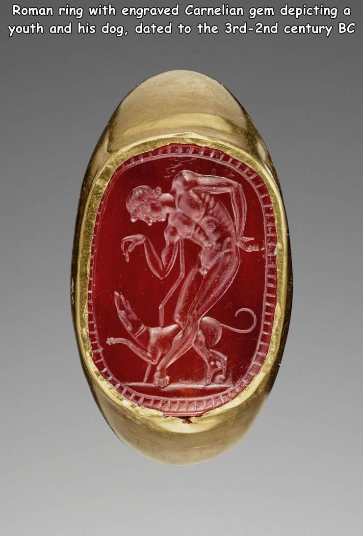 Ring - a Roman ring with engraved Carnelian gem depicting youth and his dog, dated to the 3rd2nd century Bc