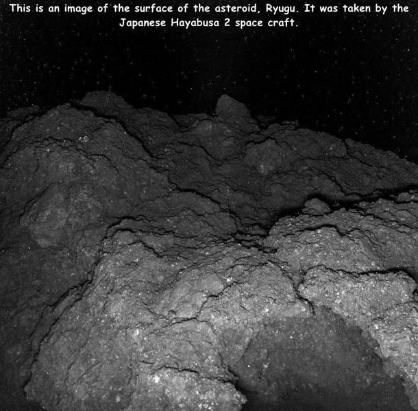 cool pics - asteroid surface - This is an image of the surface of the asteroid, Ryugu. It was taken by the Japanese Hayabusa 2 space craft.
