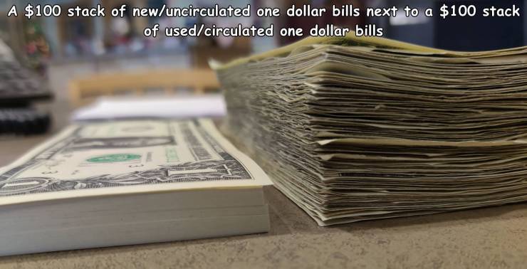 cash - A $100 stack of newuncirculated one dollar bills next to a $100 stack of usedcirculated one dollar bills