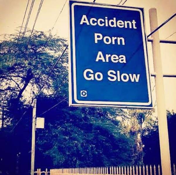 street sign - Accident Porn Area Go Slow bald