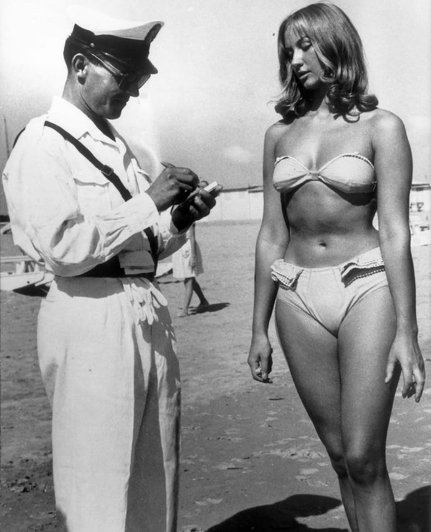 funny pictures - 1950 beach black and white photo sailor with woman in bathing suit