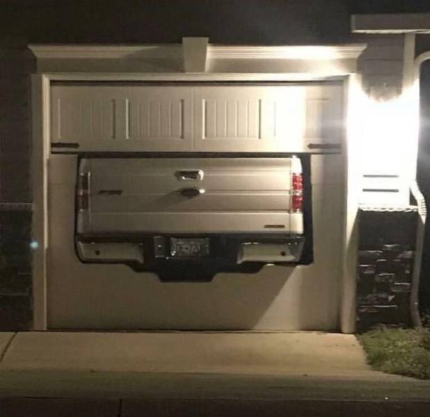 funny pictures - garage door cut out in the shape of a pick up truck