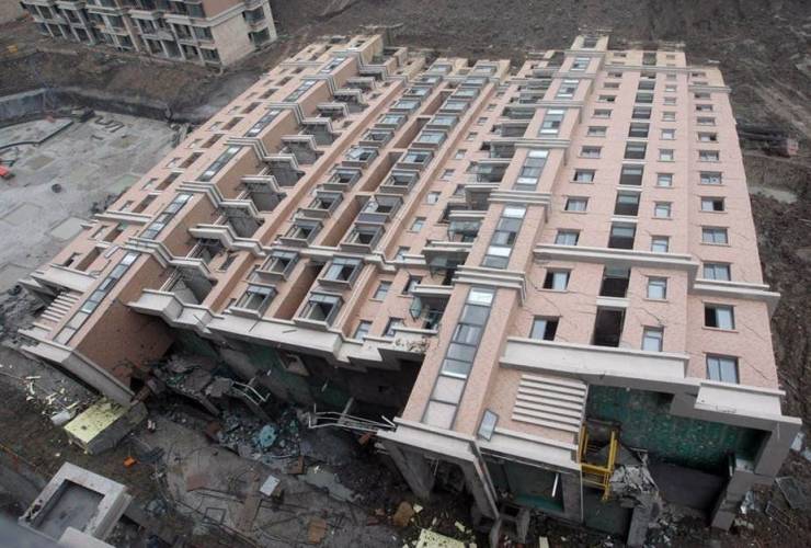 funny pictures - 13 story building fell over on its side