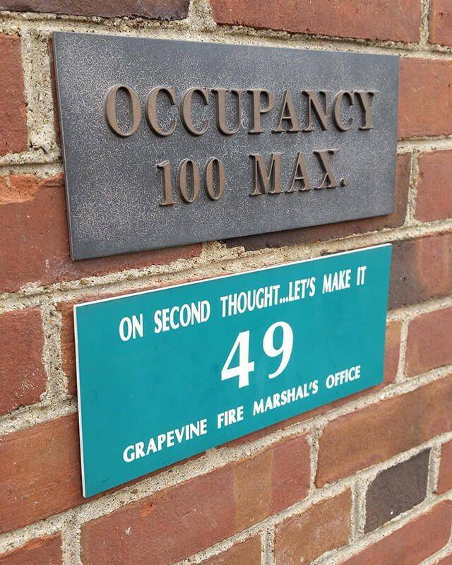 funny pics - street sign - Occupancy 100 Max On Second Thought..Let'S Make It 49 Grapevine Fire Marshal'S Office