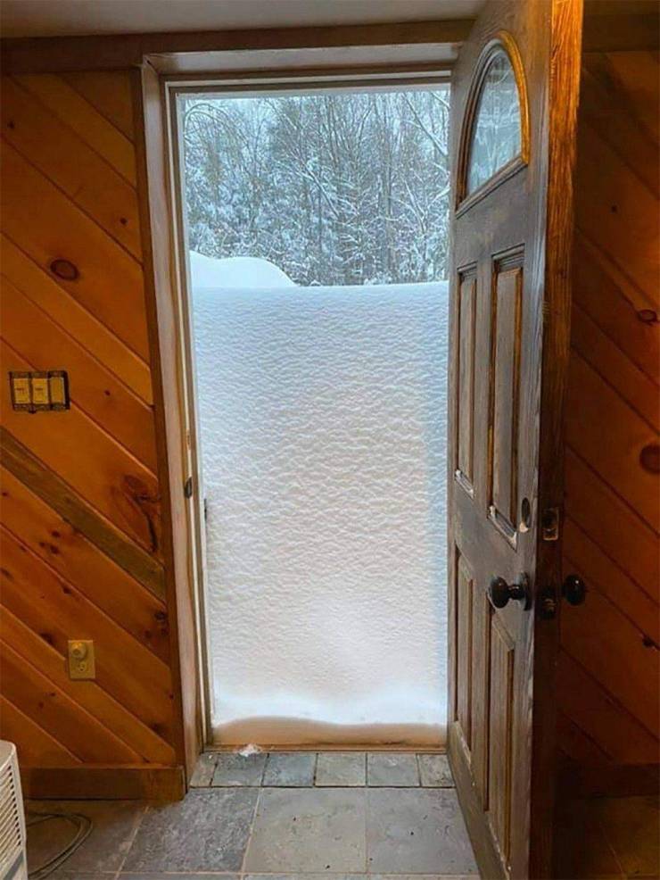 cool pics - binghamton snowfall covers front door