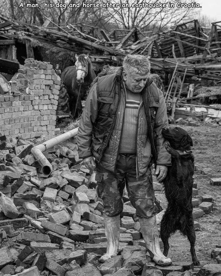 monochrome photography - A man, his dog and horse after an earthquake in Croatia. Bruno Fattulin