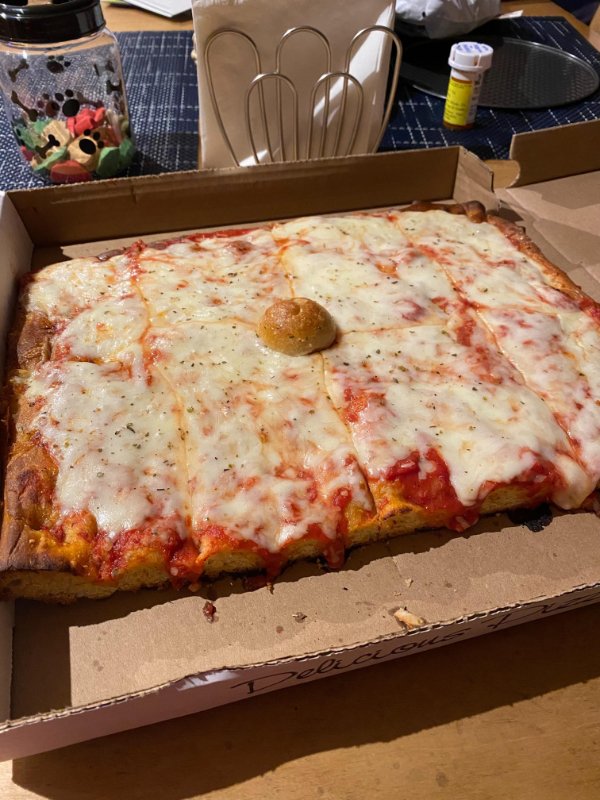 “Local pizza place uses a garlic knot to prevent the cheese from touching the box.”