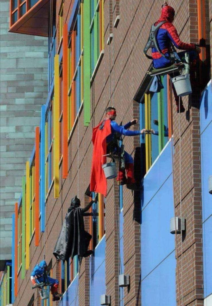 superhero window cleaners at children's hospital