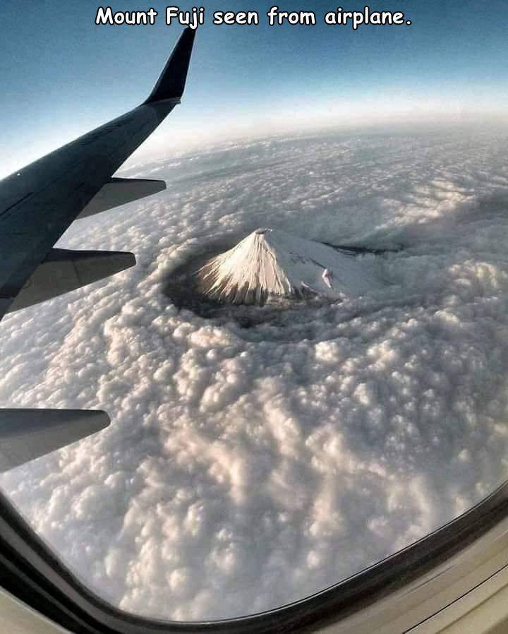 mount fuji plane window - Mount Fuji seen from airplane.