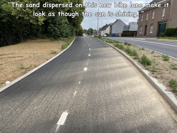 asphalt - "The sand dispersed on this new bike lane make it look as though the sun is shining