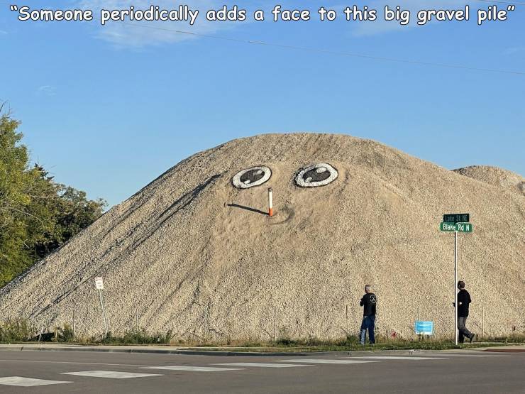 funny photos - fun pics - sky - "Someone periodically adds a face to this big gravel pile" Sne Blake Ron