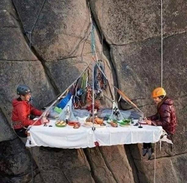 couple rock climbing camping