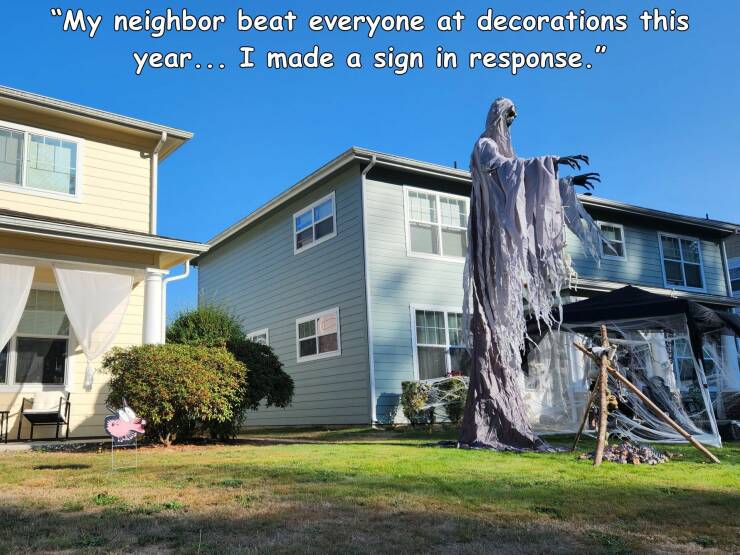 cool random pics - house - "My neighbor beat everyone at decorations this year... I made a sign in response."