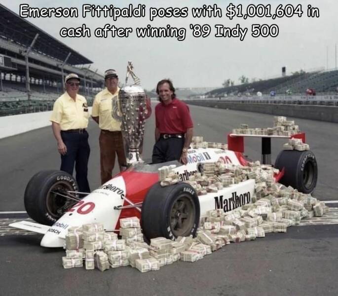 cool random pics and photos - Indianapolis 500 - Emerson Fittipaldi poses with $1,001,604 in cash after winning '89 Indy 500 Good To abil Josch boro Wk Mobil arho Marlboro