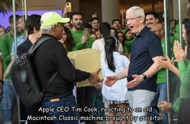 random pics and photos - event - Apple Ceo Tim Cook, reacting to an old Macintosh Classic machine brought by a visitor