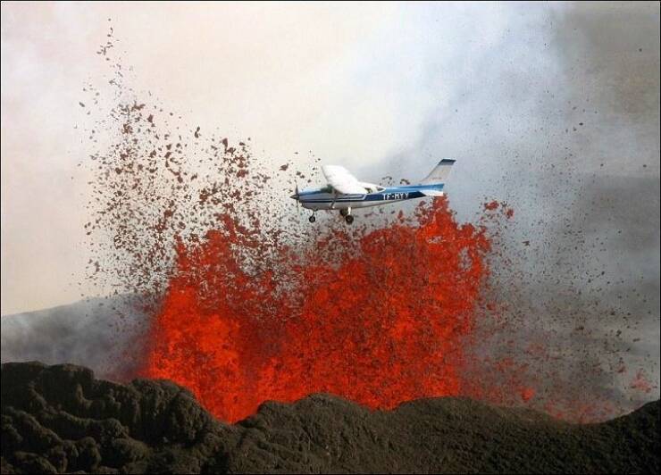 funny pics and cool photos -  plane flying over volcano