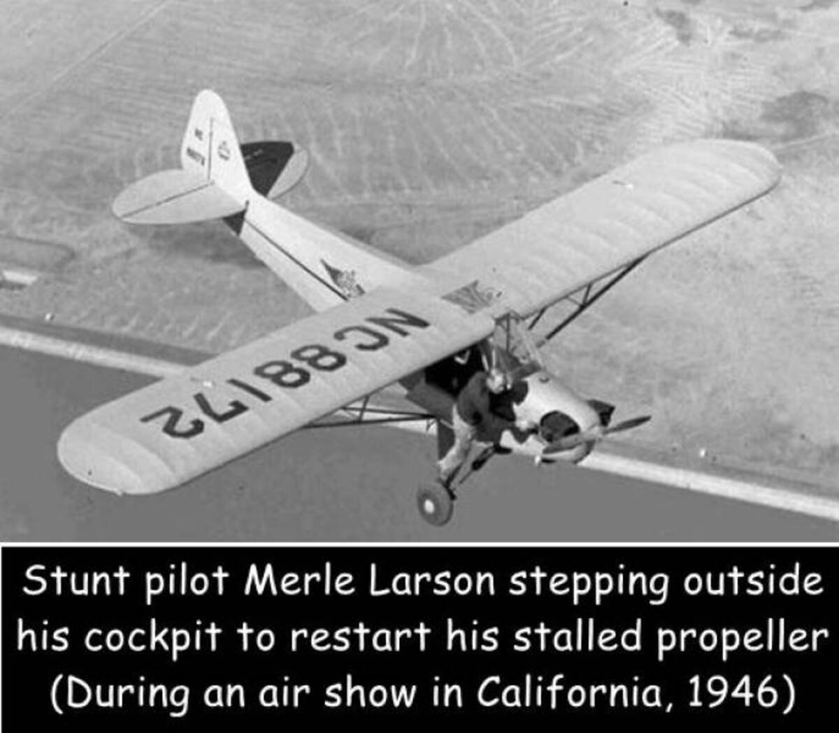 fixing plane in flight - 24188 On We Stunt pilot Merle Larson stepping outside his cockpit to restart his stalled propeller During an air show in California, 1946