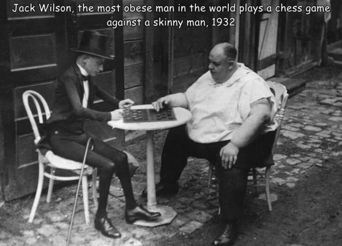 snapshot - Jack Wilson, the most obese man in the world plays a chess game against a skinny man, 1932 Sen